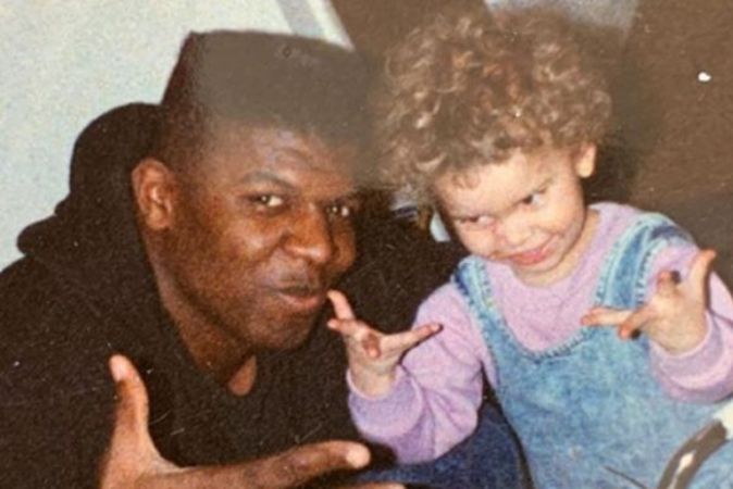 A picture of baby Naomi Burton Crews and younger Terry Crews. 